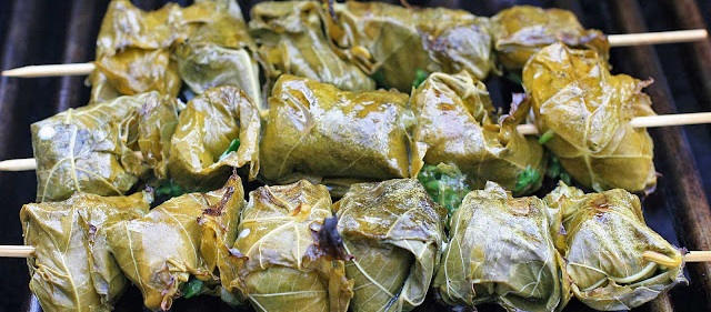 Grilled Fish Wrapped in Grape Leaves with Sweet and Sour Dipping Sauce